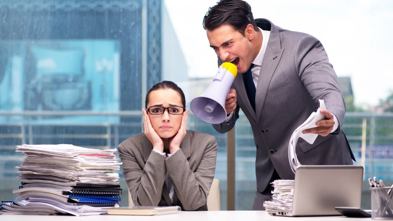 man with megaphone talking near a person